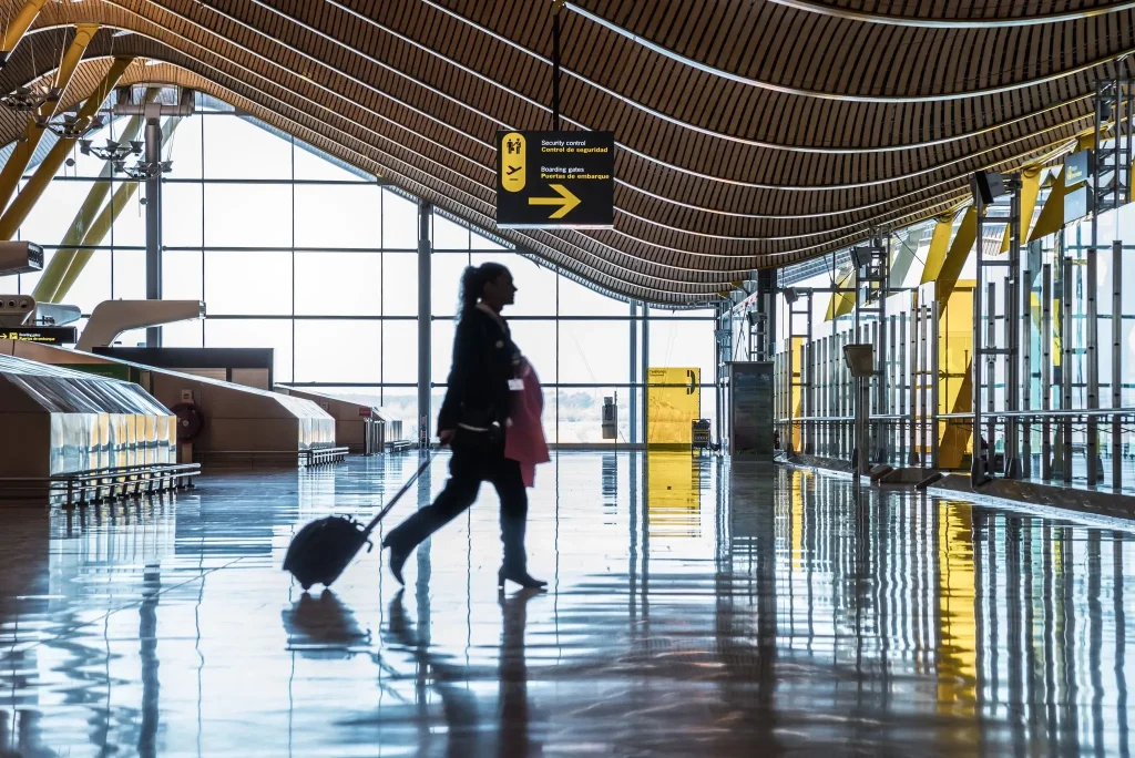 A girl walking through Cabo Airport.